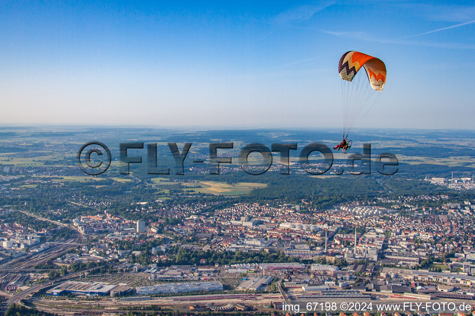 Paragliding over the city in the district Weststadt in Ulm in the state Baden-Wuerttemberg, Germany