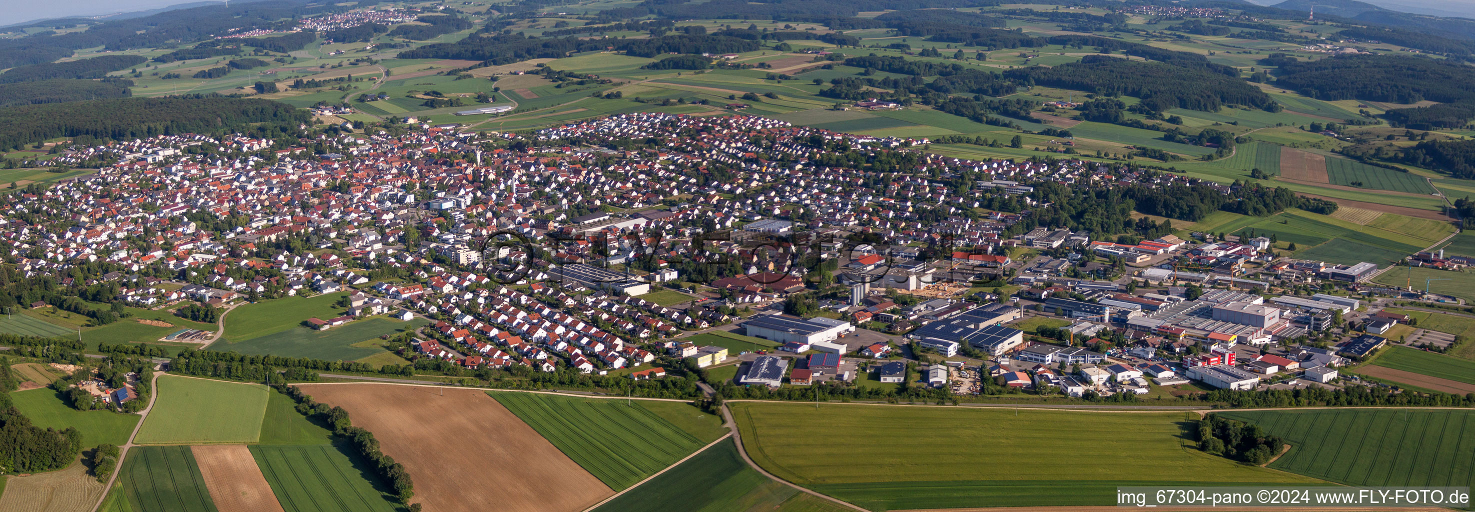 Panoramic perspective Village - view on the edge of agricultural fields and farmland in Laichingen in the state Baden-Wurttemberg, Germany