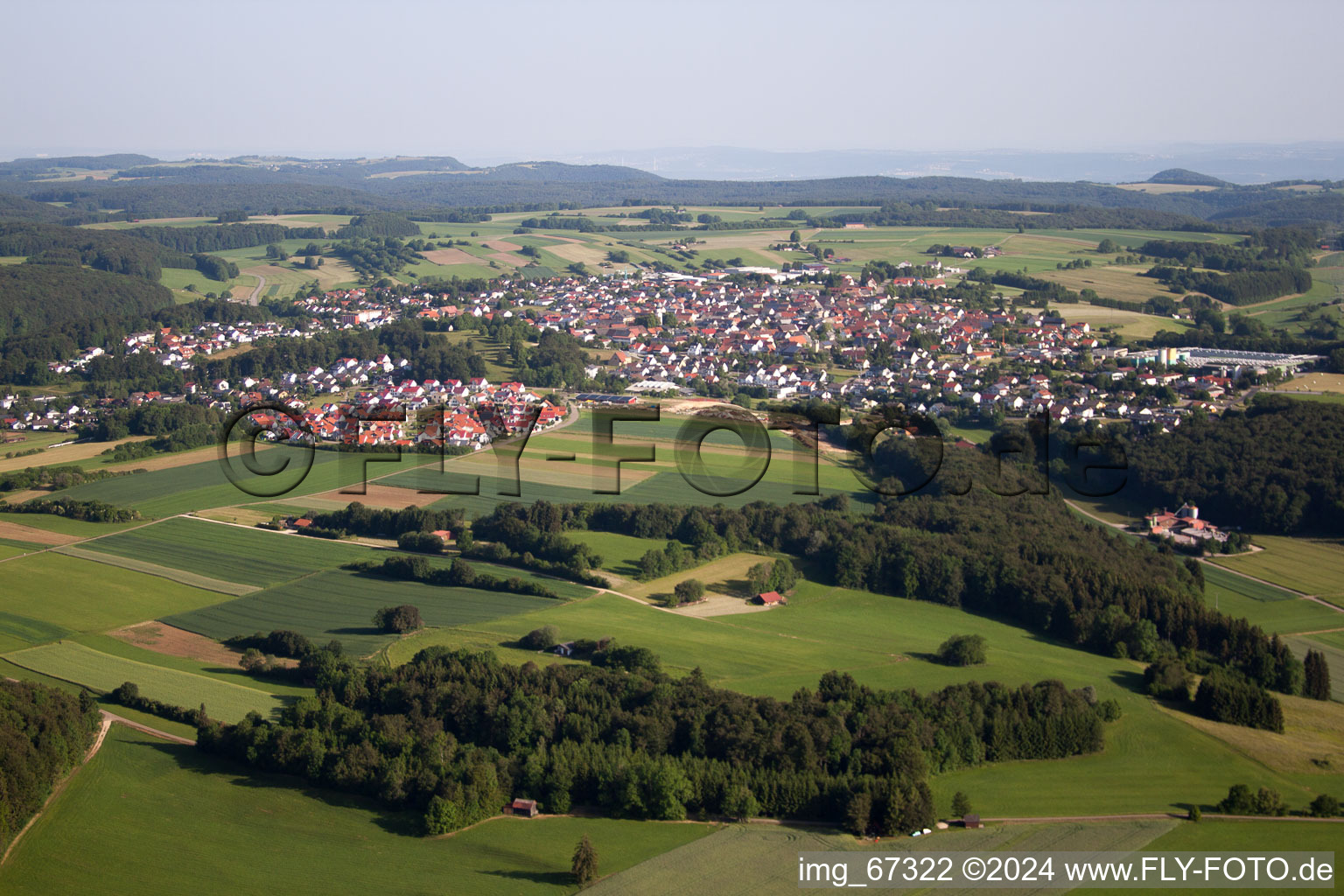 Village - view on the edge of agricultural fields and farmland in the district Feldstetten in Laichingen in the state Baden-Wurttemberg, Germany