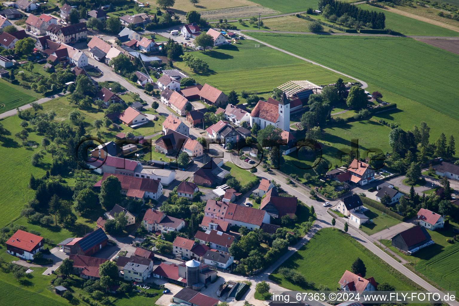 Aerial view of Village - view on the edge of agricultural fields and farmland in Allmendingen in the state Baden-Wurttemberg, Germany