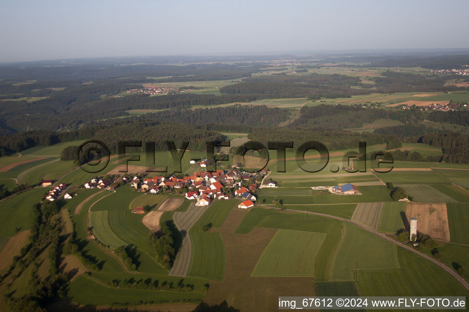 Aerial view of Village - view on the edge of agricultural fields and farmland in Bremelau in the state Baden-Wurttemberg