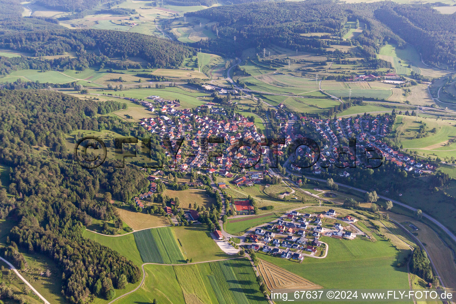 Aerial view of Village - view on the edge of agricultural fields and farmland in Gomadingen in the state Baden-Wurttemberg, Germany