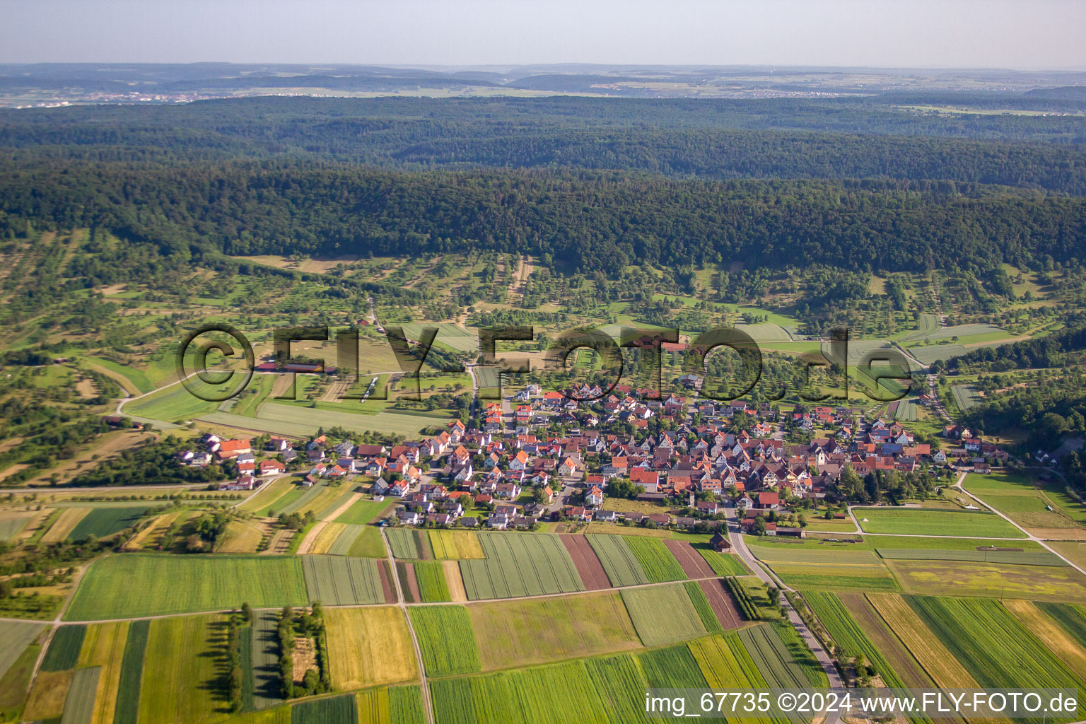 Village - view on the edge of agricultural fields and farmland in the district Breitenholz in Ammerbuch in the state Baden-Wurttemberg, Germany