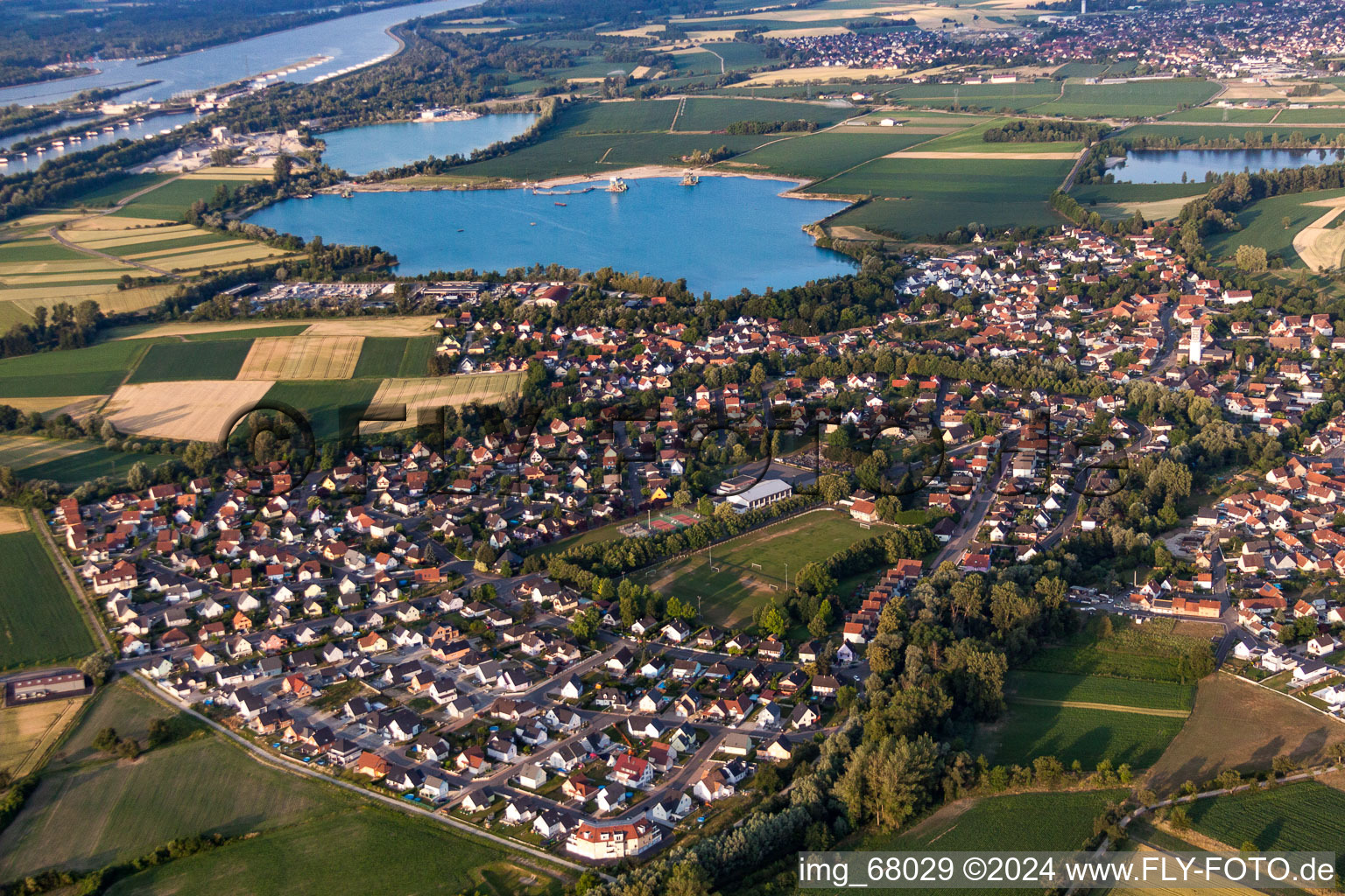 Village on the lake bank areas of gravel lake in Offendorf in Grand Est, France