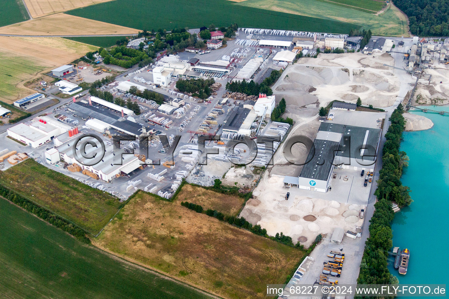 Aerial view of Mixed concrete and building materials factory of Birkenmeier Stein+Design in Gravel mine in the district Niederrimsingen in Breisach am Rhein in the state Baden-Wurttemberg, Germany