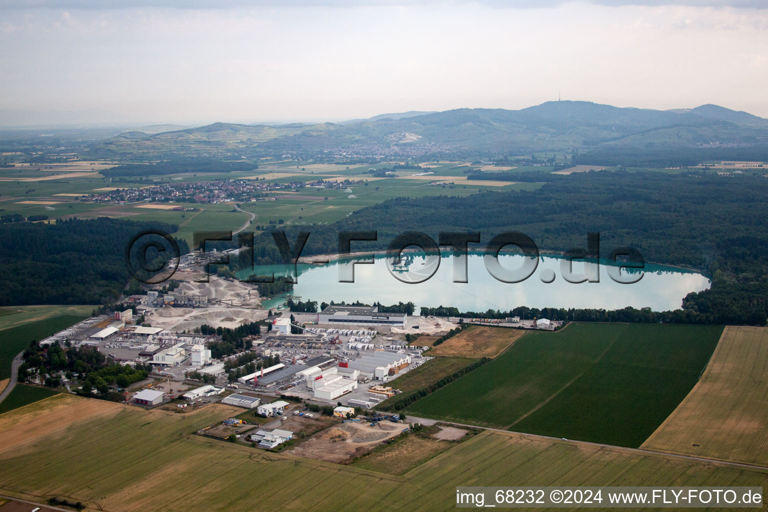 Oblique view of Mixed concrete and building materials factory of Birkenmeier Stein+Design in Gravel mine in the district Niederrimsingen in Breisach am Rhein in the state Baden-Wurttemberg, Germany