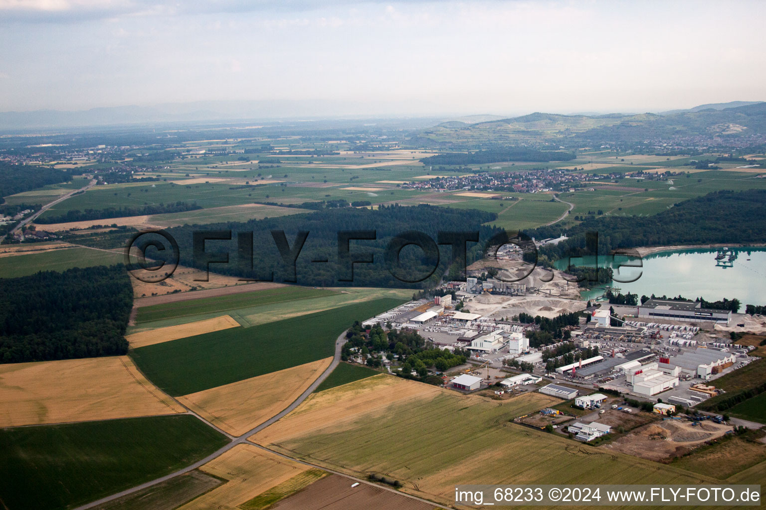 Mixed concrete and building materials factory of Birkenmeier Stein+Design in Gravel mine in the district Niederrimsingen in Breisach am Rhein in the state Baden-Wurttemberg, Germany from above