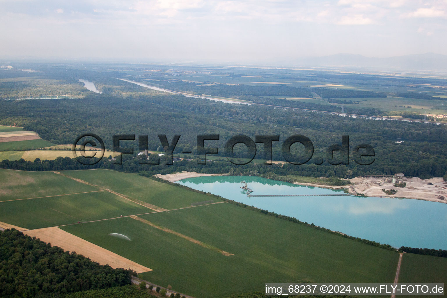 Bird's eye view of Mixed concrete and building materials factory of Birkenmeier Stein+Design in Gravel mine in the district Niederrimsingen in Breisach am Rhein in the state Baden-Wurttemberg, Germany