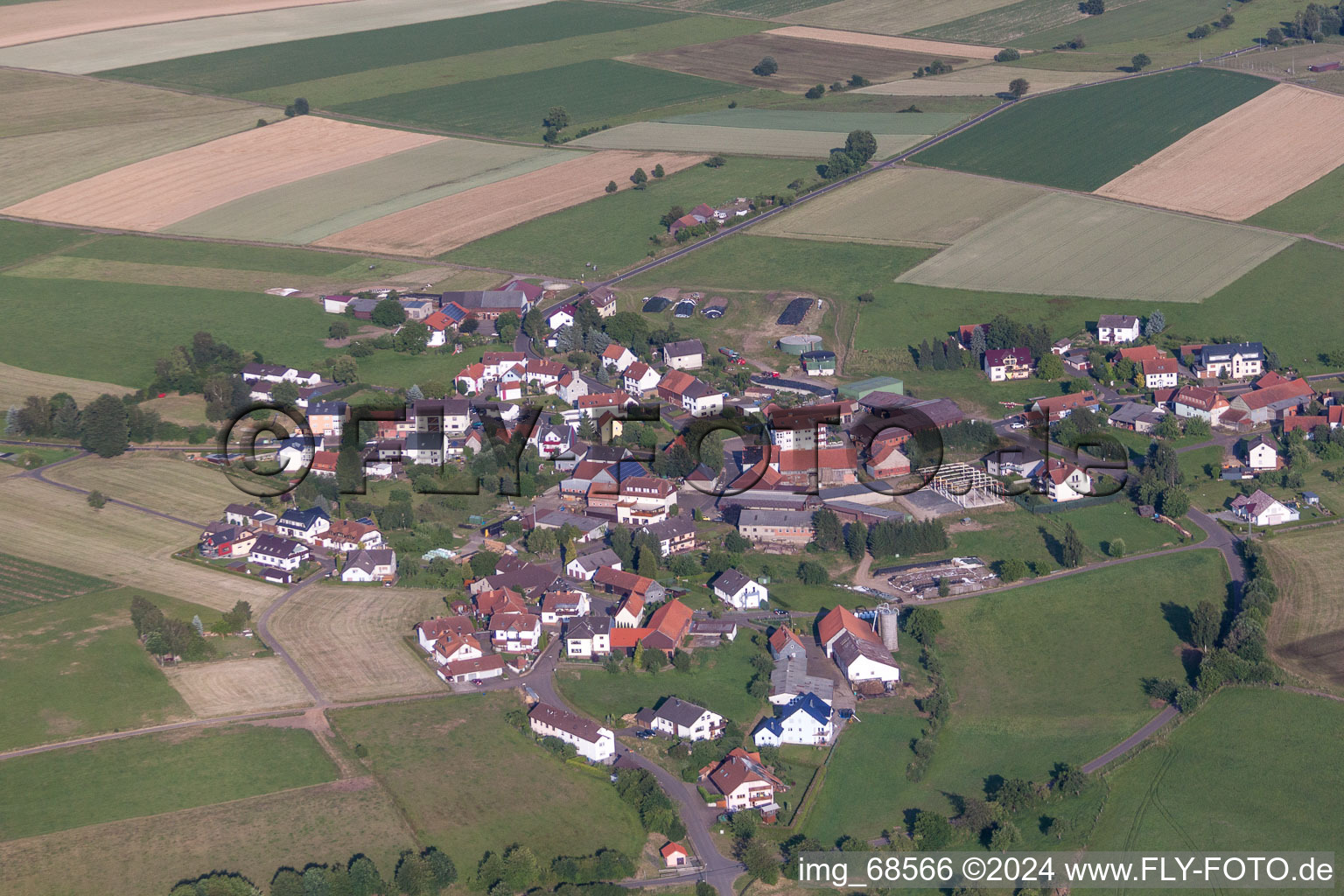 Village - view on the edge of agricultural fields and farmland in Sarrod in the state Hesse, Germany