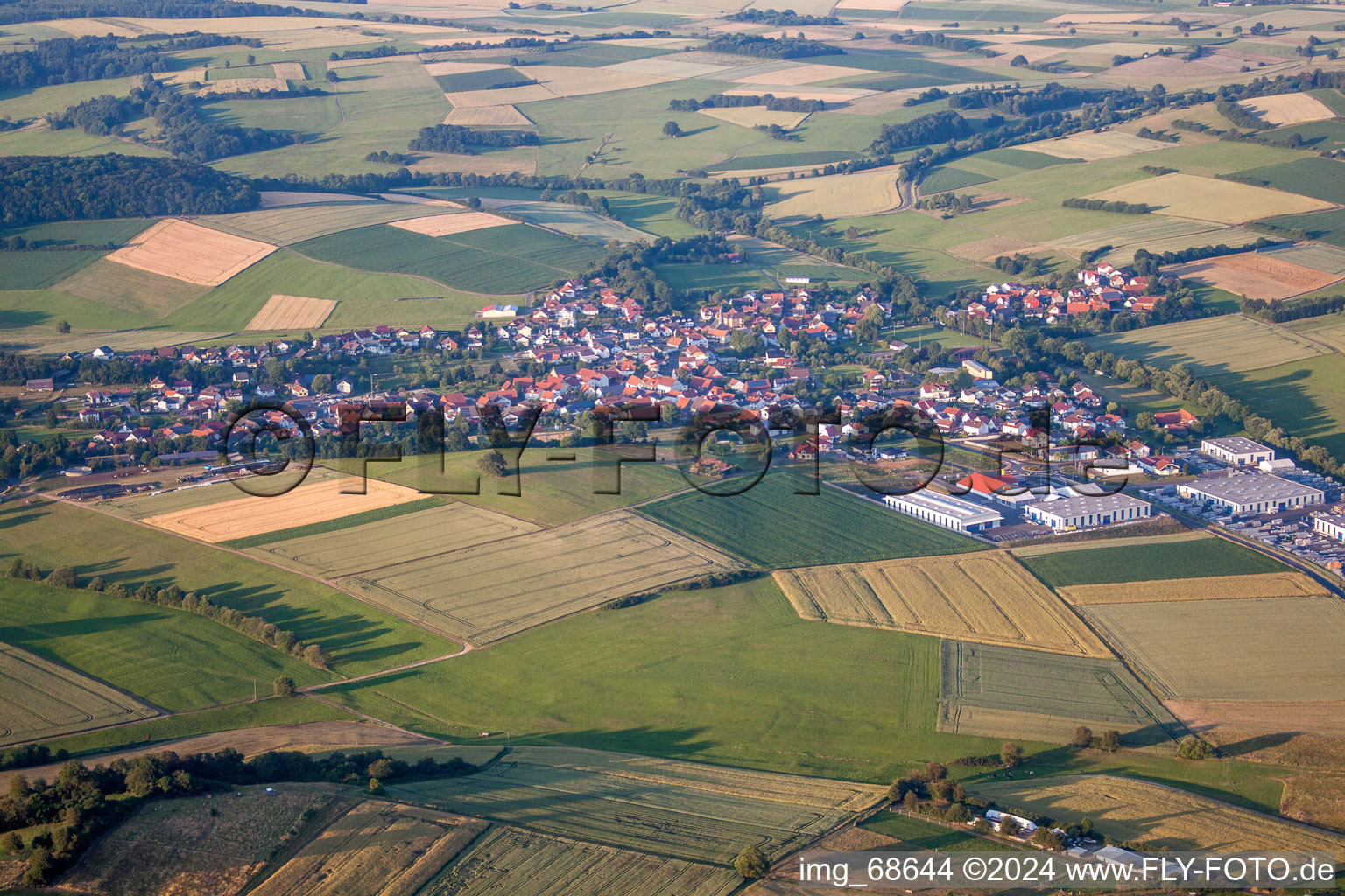 Village - view on the edge of agricultural fields and farmland in Kefenrod in the state Hesse, Germany