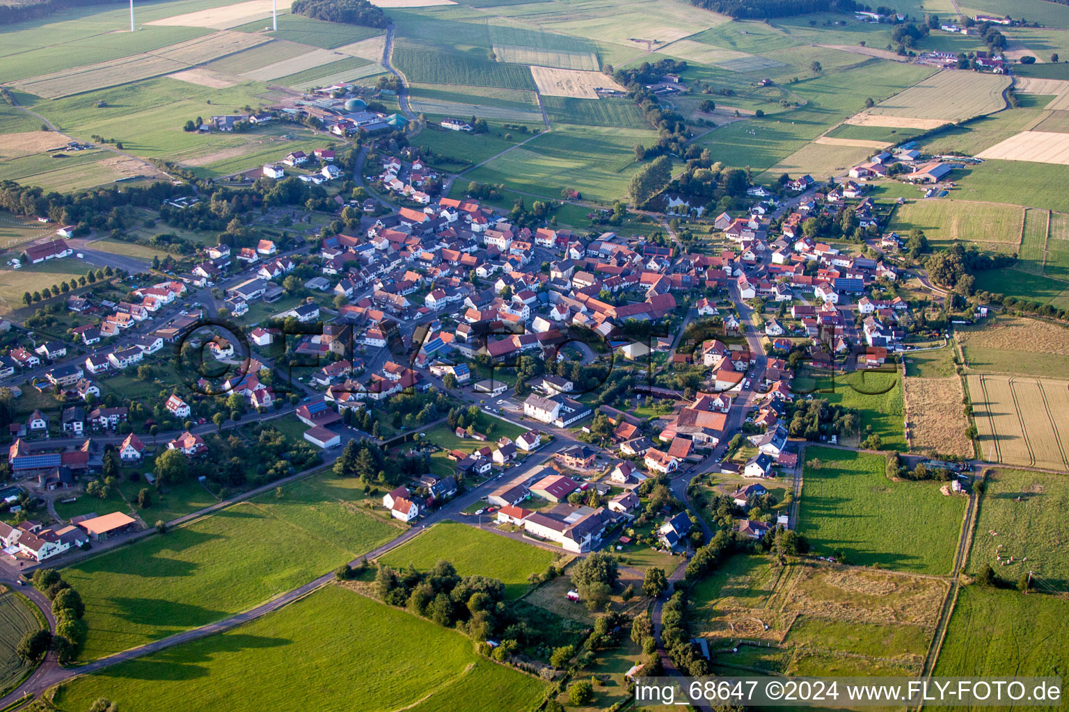 Village - view on the edge of agricultural fields and farmland in Wenings in the state Hesse, Germany