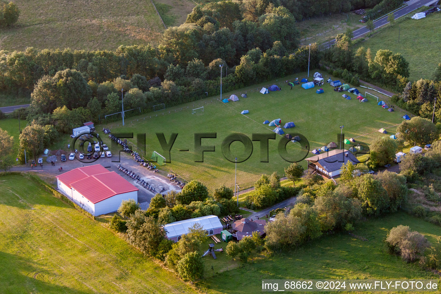 Aerial view of Football field with tent camp in the district Burkhards in Schotten in the state Hesse, Germany