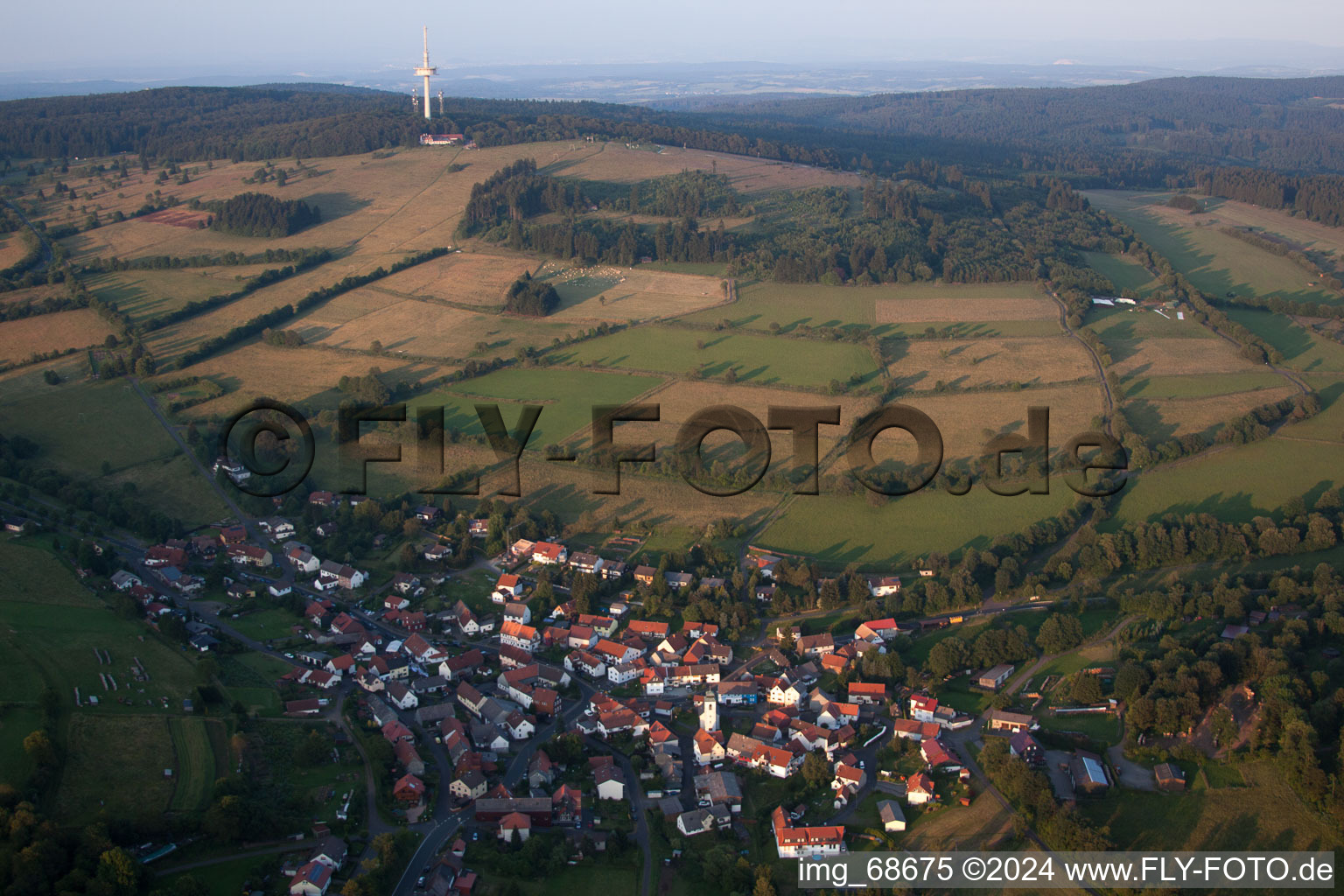 Aerial photograpy of Village - view on the edge of agricultural fields and farmland in Breungeshain in the state Hesse