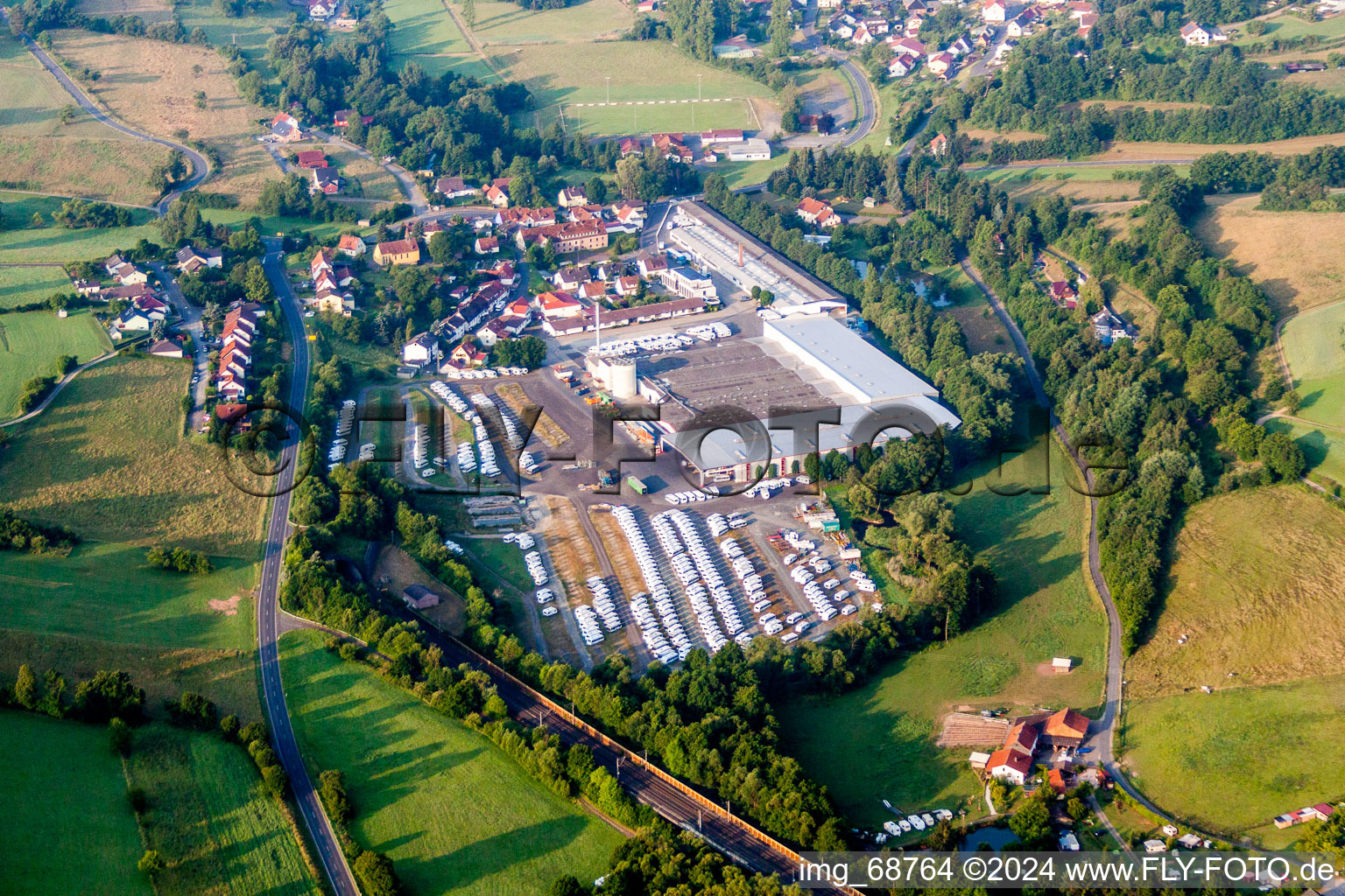 Aerial view of Buildings and production halls on the motorhome and caravan vehicle construction site Knaus Tabbert in Sinntal in the state Hesse, Germany