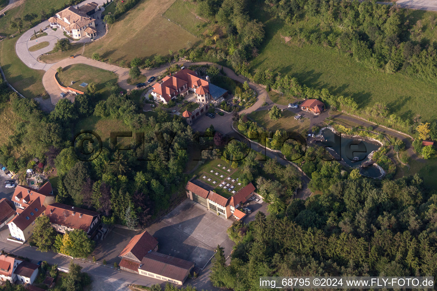 Aerial view of Luxury villa in residential area of single-family settlement in Oberleichtersbach in the state Bavaria, Germany