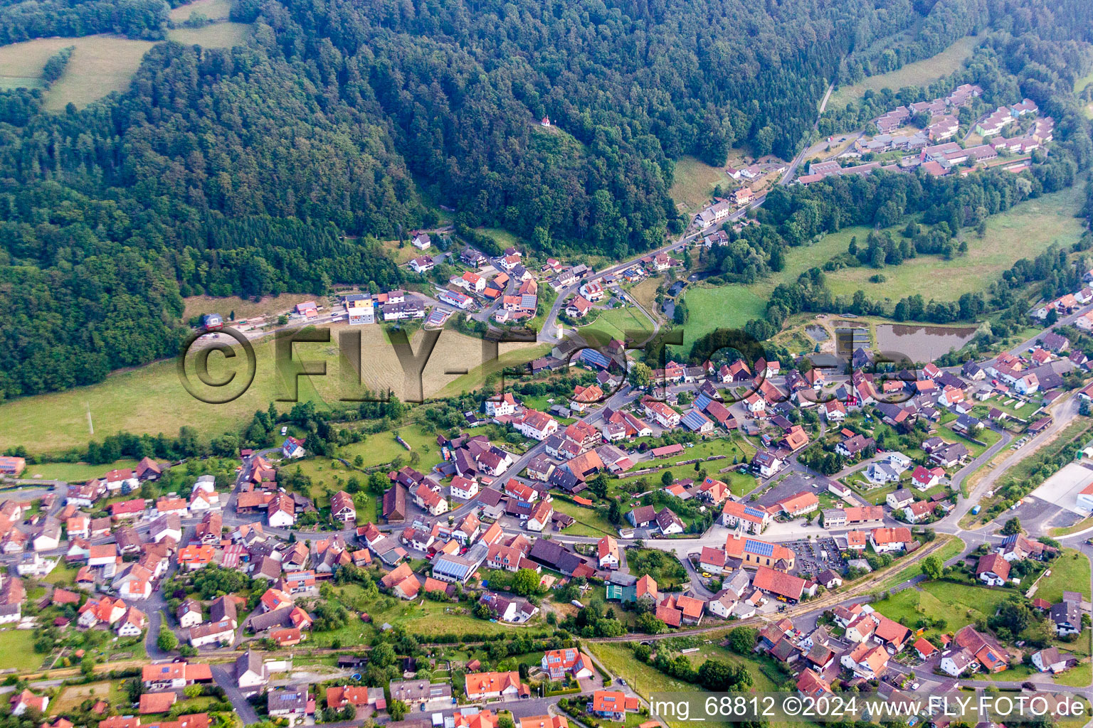 Village - view on the edge of agricultural fields and farmland in Riedenberg in the state Bavaria, Germany