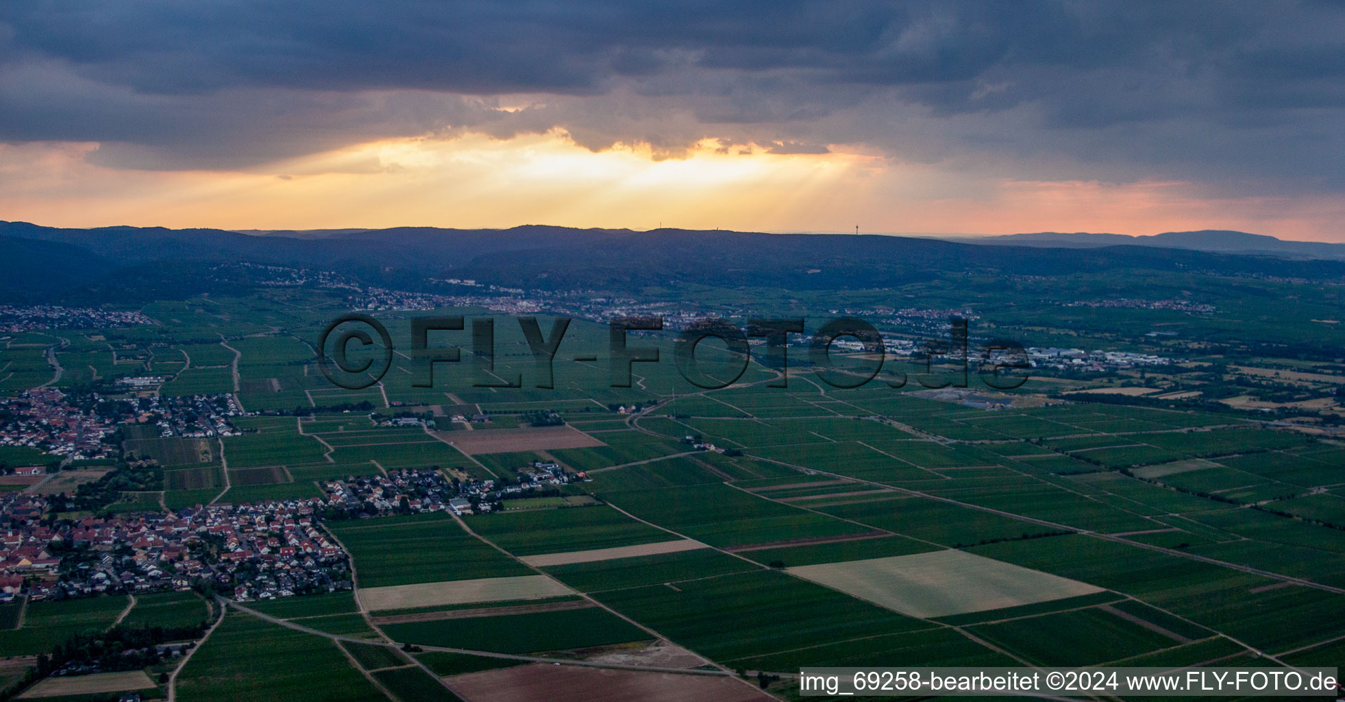 Weather situation with solar radiation from openings in the cloud cover above the Haardt edge in Gönnheim in the state Rhineland-Palatinate, Germany