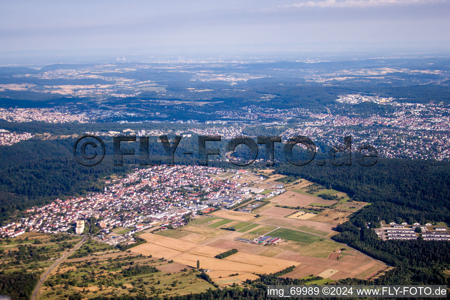 Village - view on the edge of agricultural fields and farmland in the nothern black forest in the district Huchenfeld in Pforzheim in the state Baden-Wurttemberg, Germany