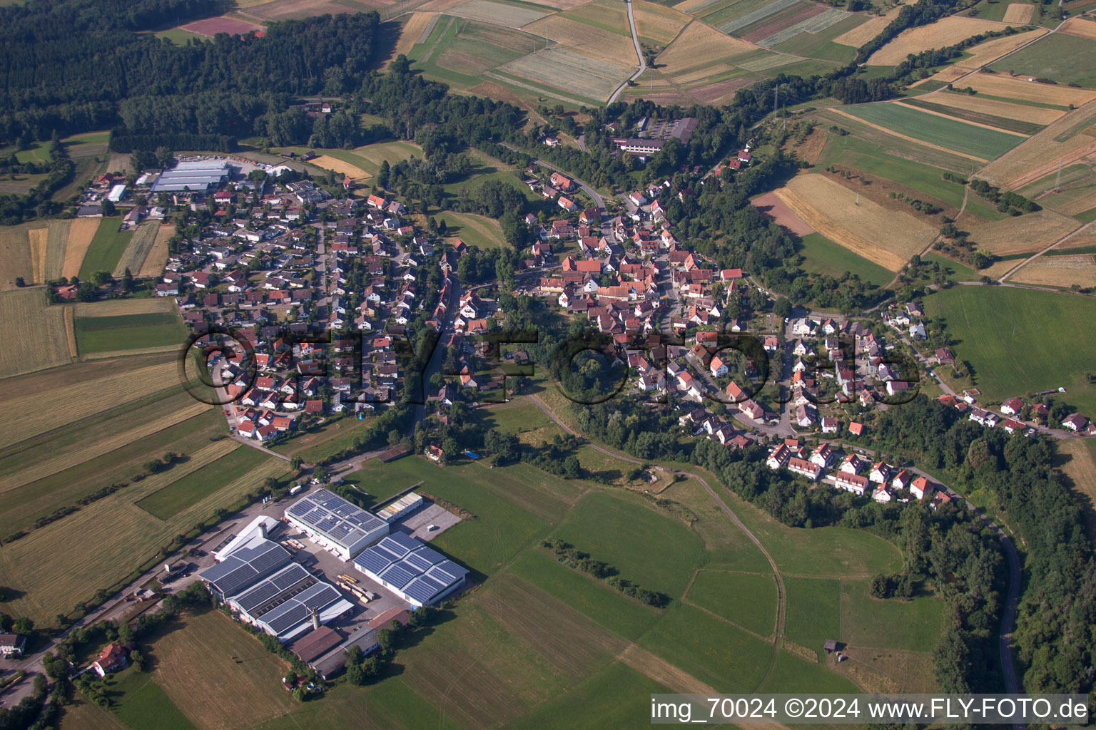 Village - view on the edge of agricultural fields and farmland in the district Hausen in Weil der Stadt in the state Baden-Wurttemberg, Germany