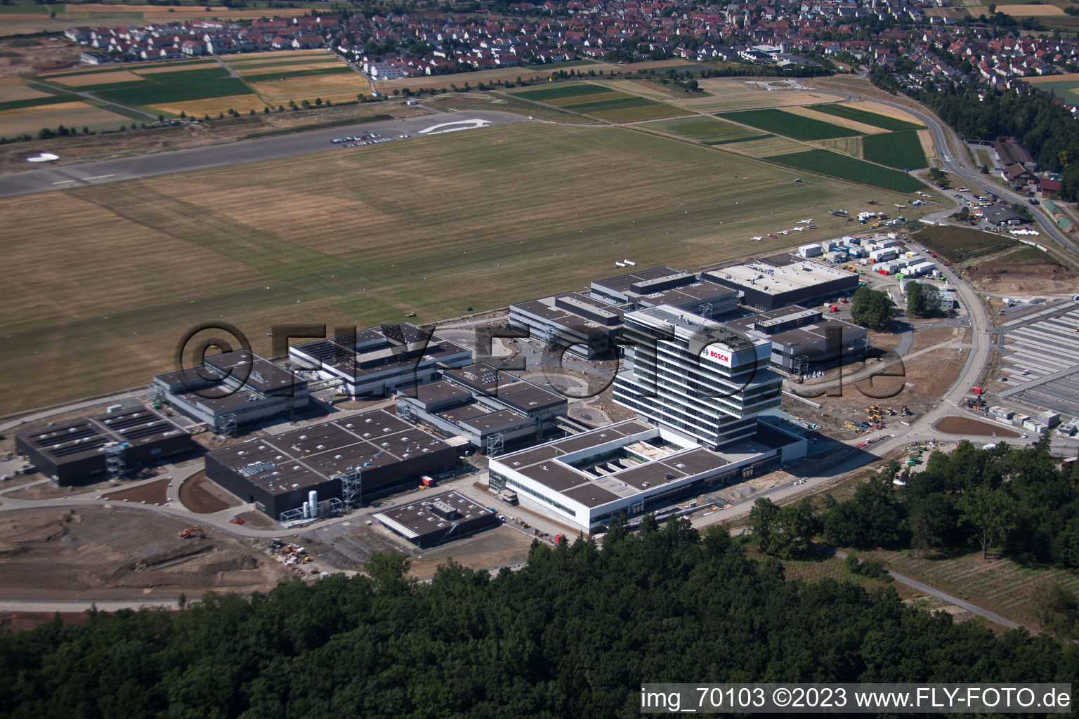 Aerial view of Research building and office complex of Robert Bosch GmbH Zentrum fuer Forschung and Vorausentwicklung at glider airfield in Renningen in the state Baden-Wurttemberg, Germany