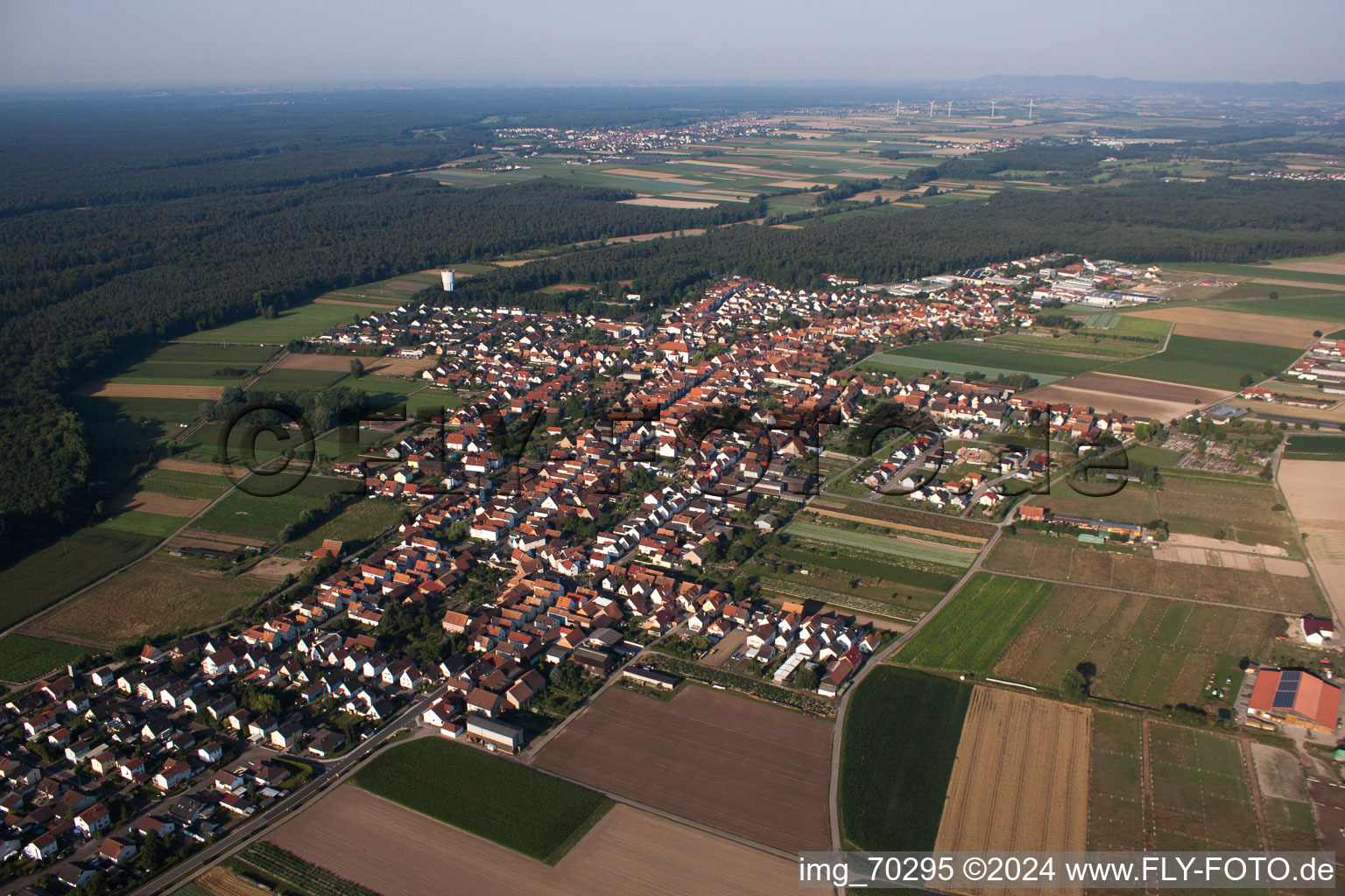 Aerial view of Village - view on the edge of agricultural fields and farmland in Hatzenbuehl in the state Rhineland-Palatinate, Germany