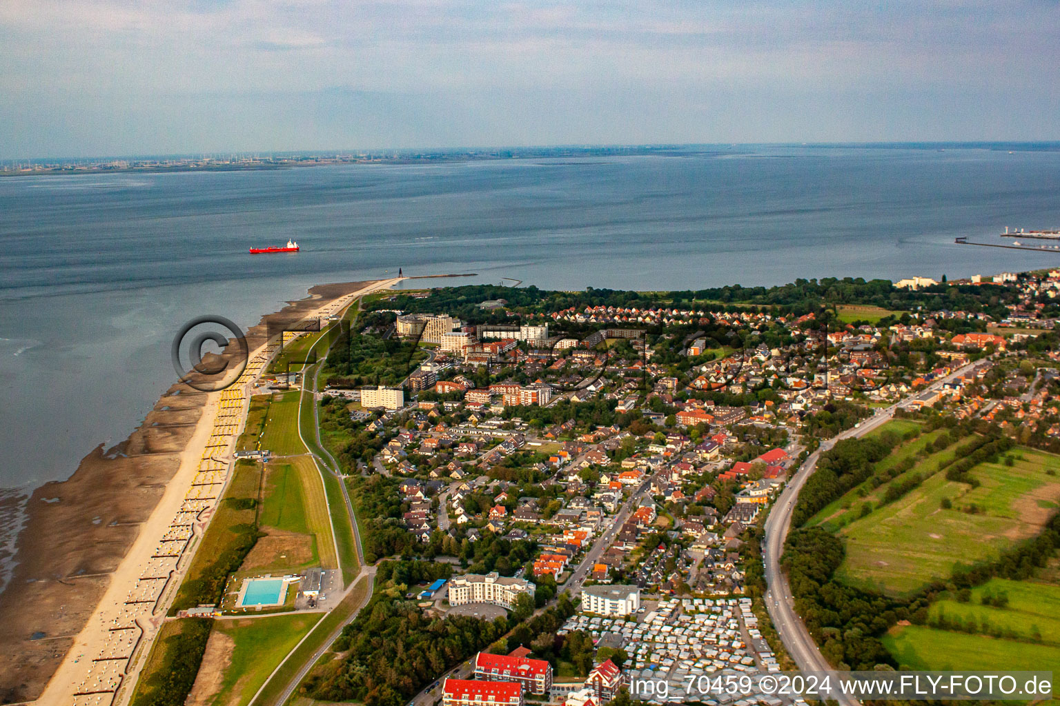 Rows of beach chairs on the sandy beach up to the Kugelbake in the coastal area of the North Sea with the Wattenlöper and Nordsee campsites in the foreground in the district Döse in Cuxhaven in the state Lower Saxony, Germany