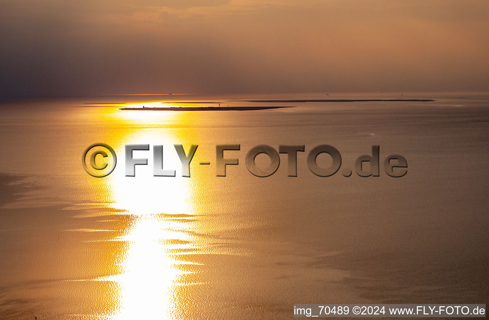 Island Neuwerk at high tide at sunset in Neuwerk in the state Hamburg, Germany