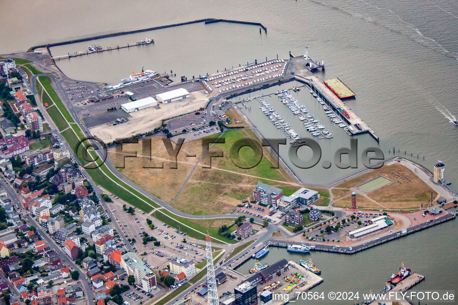 Port facilities on the banks of the Landwehrkanal harbor basin and Alte Liebe lighthouse in Cuxhaven in the state Lower Saxony, Germany