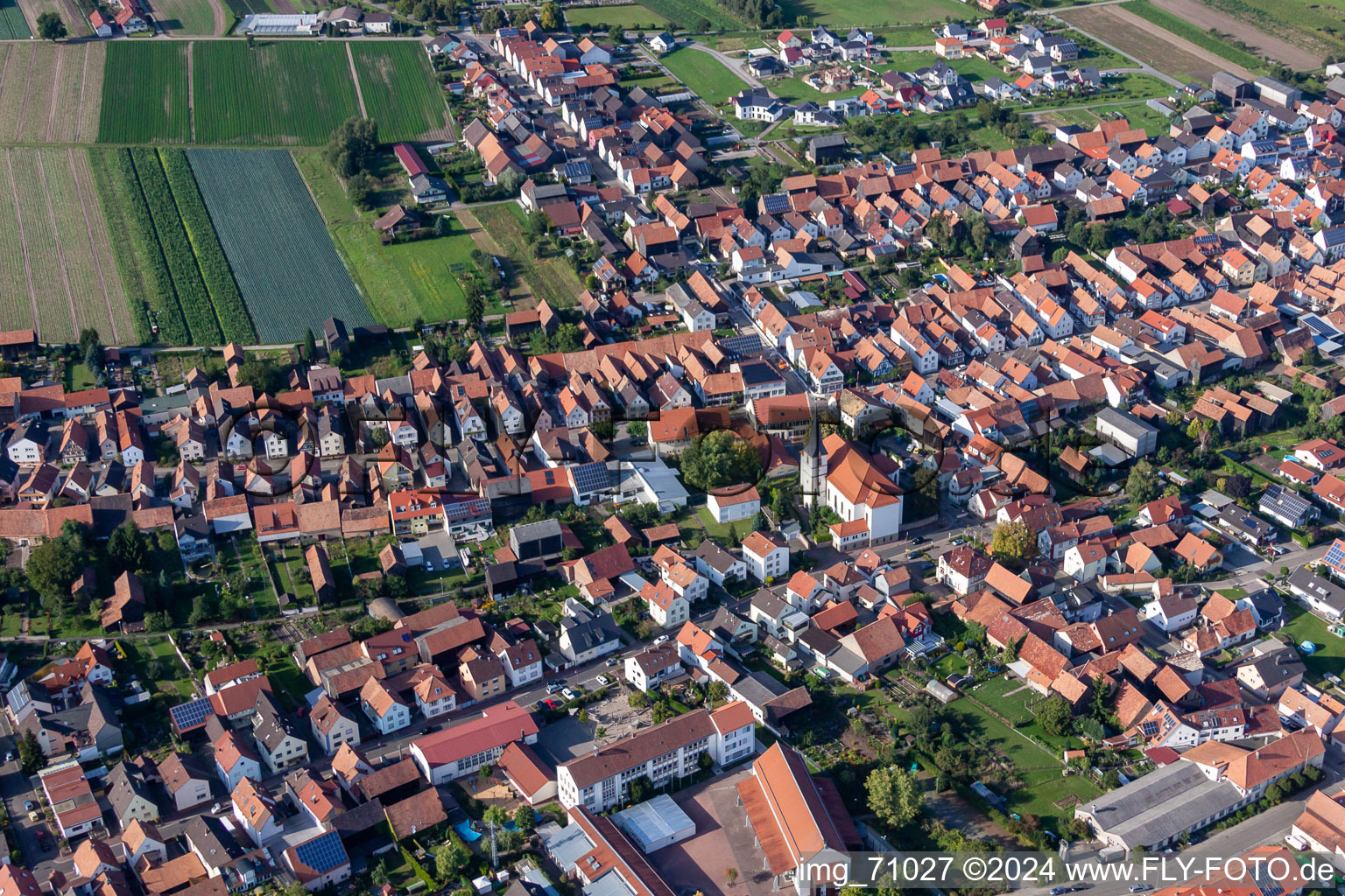 Aerial photograpy of Village - view on the edge of agricultural fields and farmland in Hatzenbuehl in the state Rhineland-Palatinate, Germany