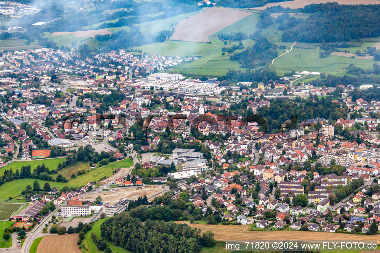 Aerial view of Town View of the streets and houses of the residential areas in morning fog in Stockach in the state Baden-Wurttemberg, Germany