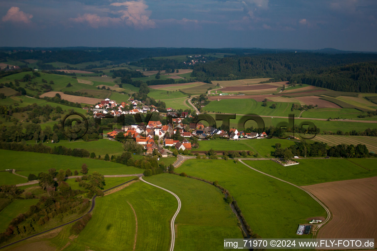 Village - view on the edge of agricultural fields and farmland in Buehlertann in the state Baden-Wurttemberg, Germany