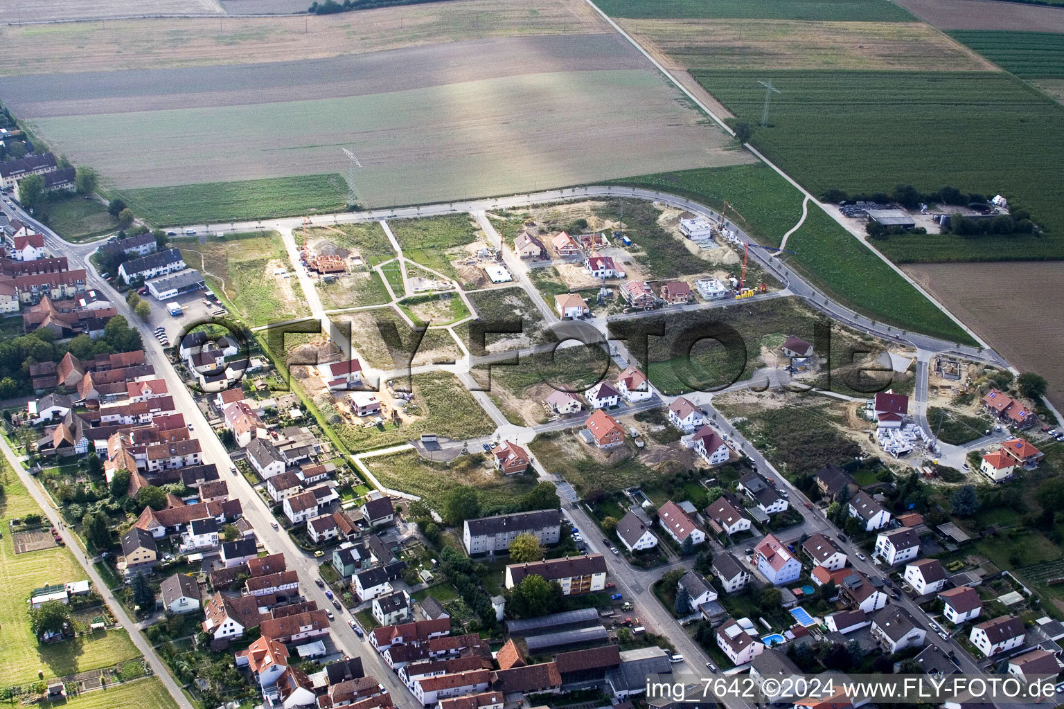 Construction sites for new construction residential area of detached housing estate Am Hoehenweg in Kandel in the state Rhineland-Palatinate seen from above