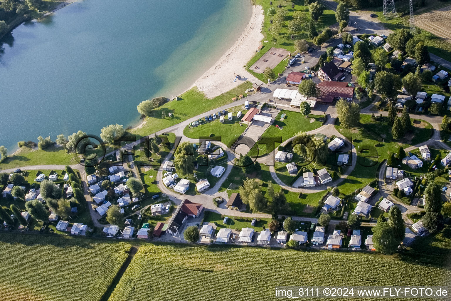 Aerial photograpy of Camping with caravans and tents at the lake shore in Roeschwoog in Grand Est, France