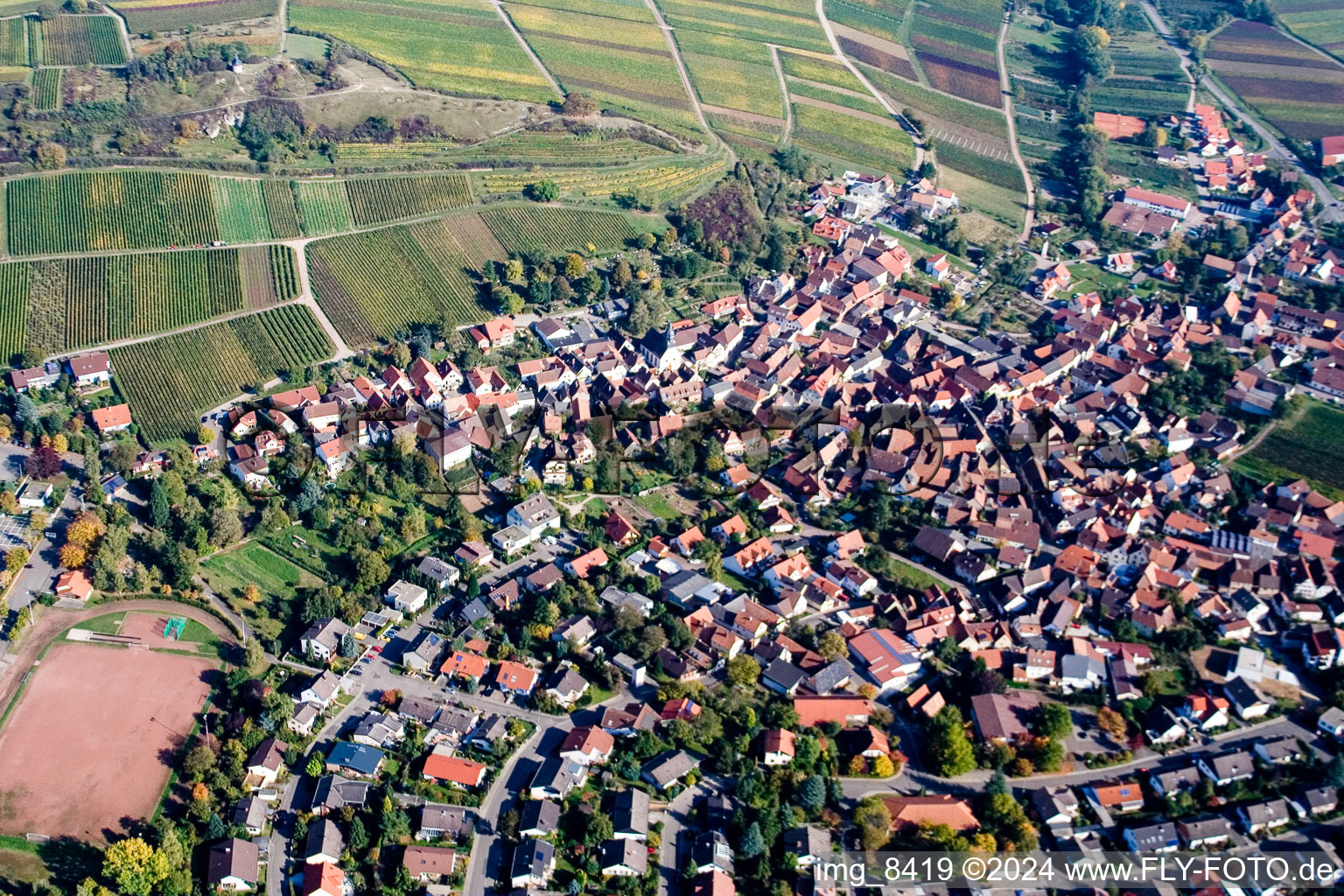 Village - view on the edge of vine yards and the nature reserve and chapel Kleine Kalmit in Ilbesheim bei Landau in der Pfalz in the state Rhineland-Palatinate