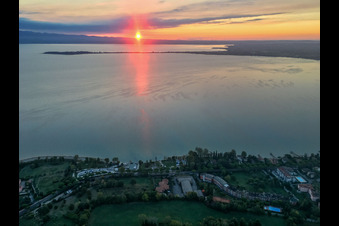 Sunrise at Barche Bellandi on Lake Garda in Desenzano del Garda in the state Brescia, Italy