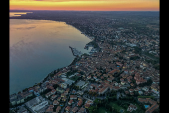 Sunrise on Lake Garda in Desenzano del Garda in the state Brescia, Italy