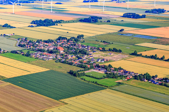 View of the town from the southeast showing the new Wollgrasweg development area under construction. in Neuenkirchen in the state Schleswig Holstein, Germany