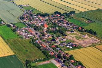View of the town from the east showing the new Wollgrasweg development area under construction in Neuenkirchen in the state Schleswig Holstein, Germany