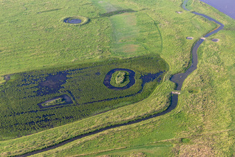 Riparian areas with mudflats along the course of the river of Eider in Karolinenkoog in the state Schleswig-Holstein, Germany