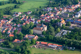 Aerial view of Village view on the edge of agricultural fields and land in Friedrichswerth in the state Thuringia, Germany