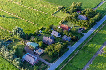 Schülpersieler Street in the district Schülperweide in Wesselburenerkoog in the state Schleswig Holstein, Germany viewn from the air