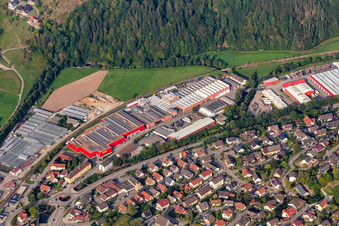 Aerial view of Buildings and production halls on the vehicle construction site of DOLL Fahrzeugbau GmbH in Oppenau in the state Baden-Wuerttemberg, Germany