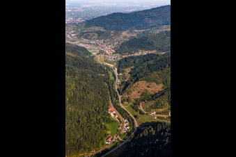 Valley landscape surrounded by mountains with B38, mill dig and Renchtal-rail-track in Lautenbach in the state Baden-Wuerttemberg, Germany