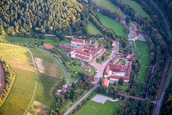 Complex of buildings of the monastery Bronnbach with garden and Church Mariae Himmelfahrt in Wertheim in the state Baden-Wurttemberg, Germany