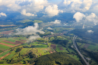 View of the town on the Main from the west and the Schwarzer Berg tunnel for the A70 in the district Limbach in Eltmann in the state Bavaria, Germany