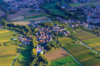Village view between autumnal vineyards from the west with Bischoff Mill in the district Appenhofen in Billigheim-Ingenheim in the state Rhineland-Palatinate, Germany