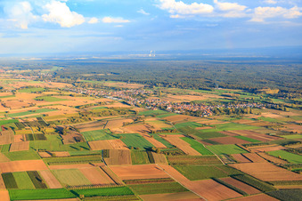 Village view between autumnal fields and meadows from the northwest in Steinfeld in the state Rhineland-Palatinate, Germany