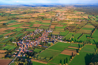 Village overview between autumnal fields and meadows from the west in Schweighofen in the state Rhineland-Palatinate, Germany