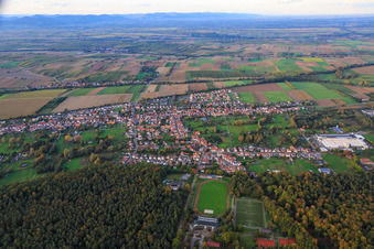 Village overview between autumnal fields and meadows on the edge of the Bienwald forest from the south in the district Schaidt in Wörth am Rhein in the state Rhineland-Palatinate, Germany