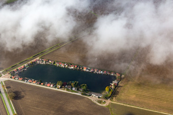 Burgsee under clouds in the district Hofheim in Lampertheim in the state Hesse, Germany